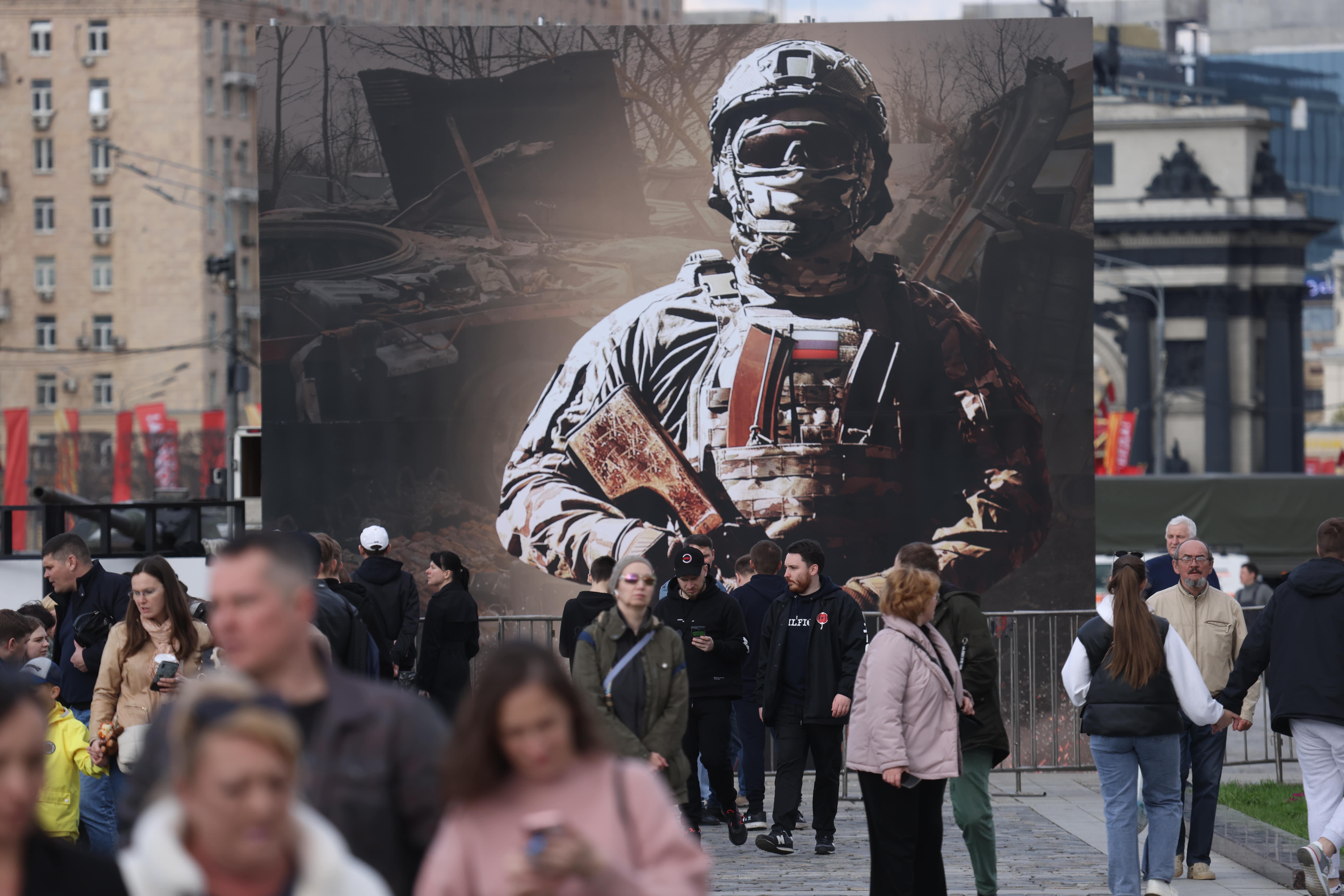 A billboard with a masked Russian soldier.