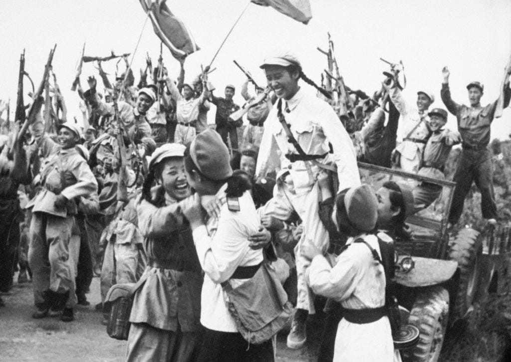 North-Korean and Chinese troops celebrate their shared victory during the Korean War