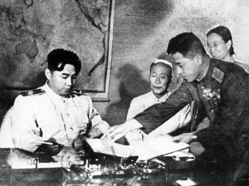 Kim Il Sung signs the Korean Armistice Agreement.