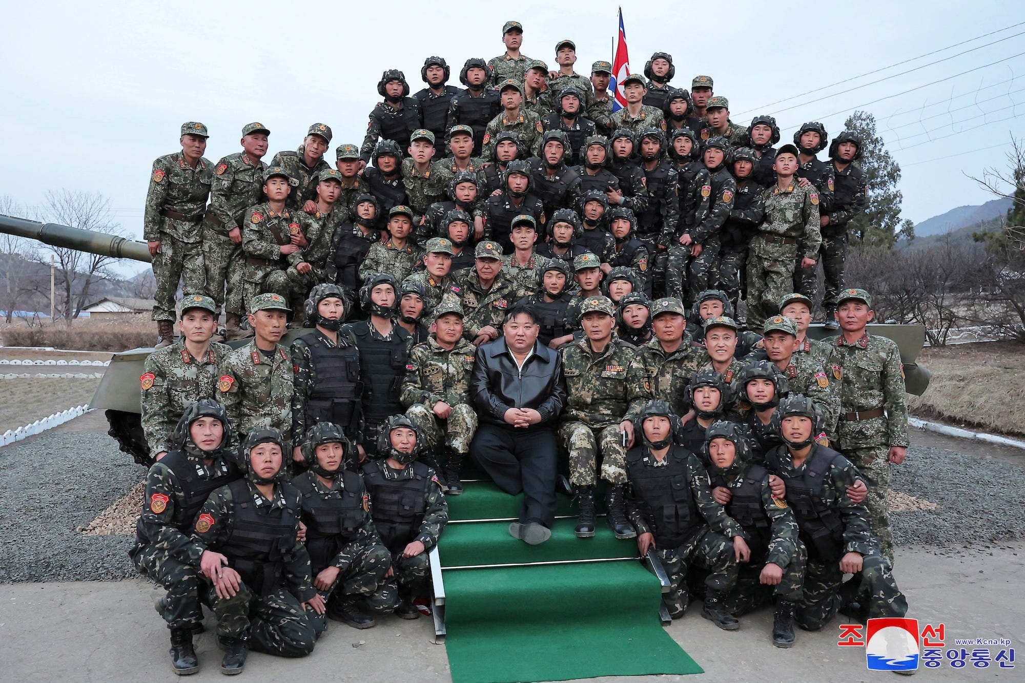 North Korean leader Kim Jong Un poses with soldiers