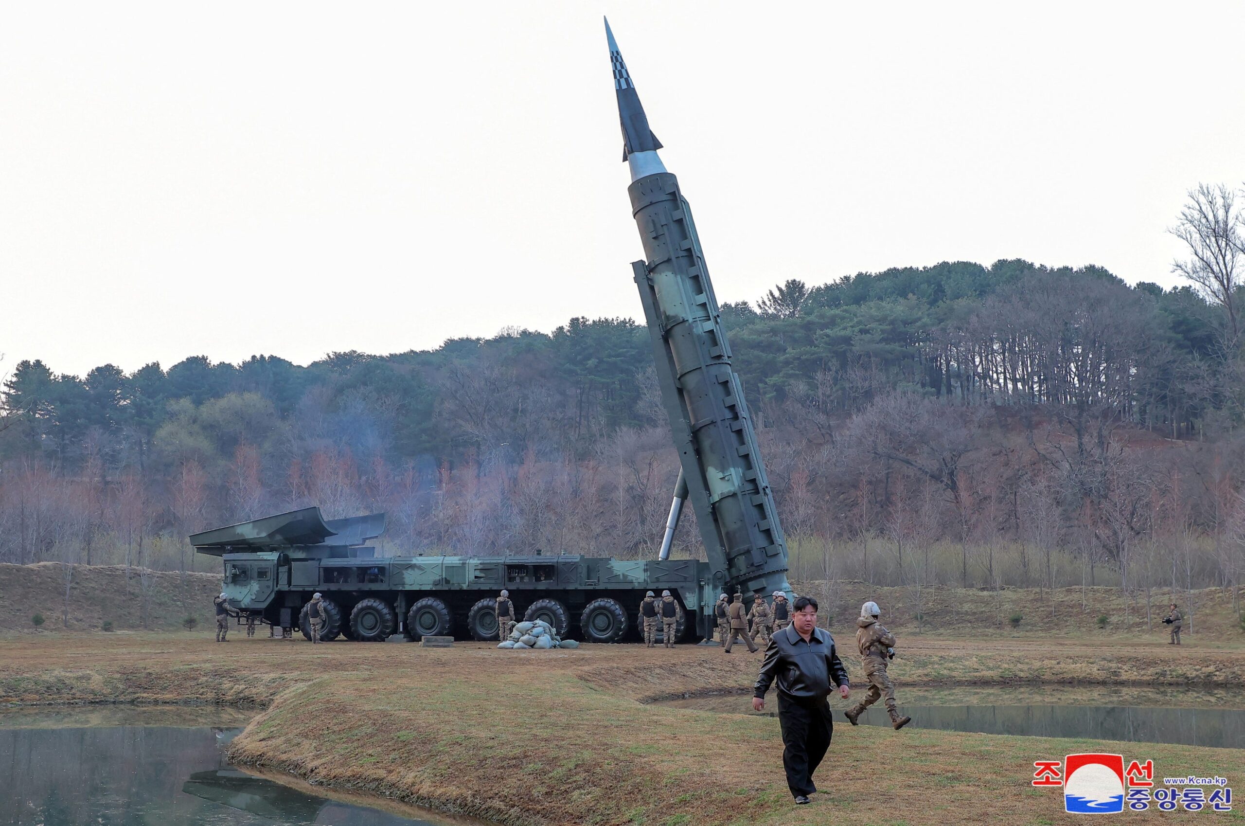 Kim Jong-un attends a test launch of a missile.