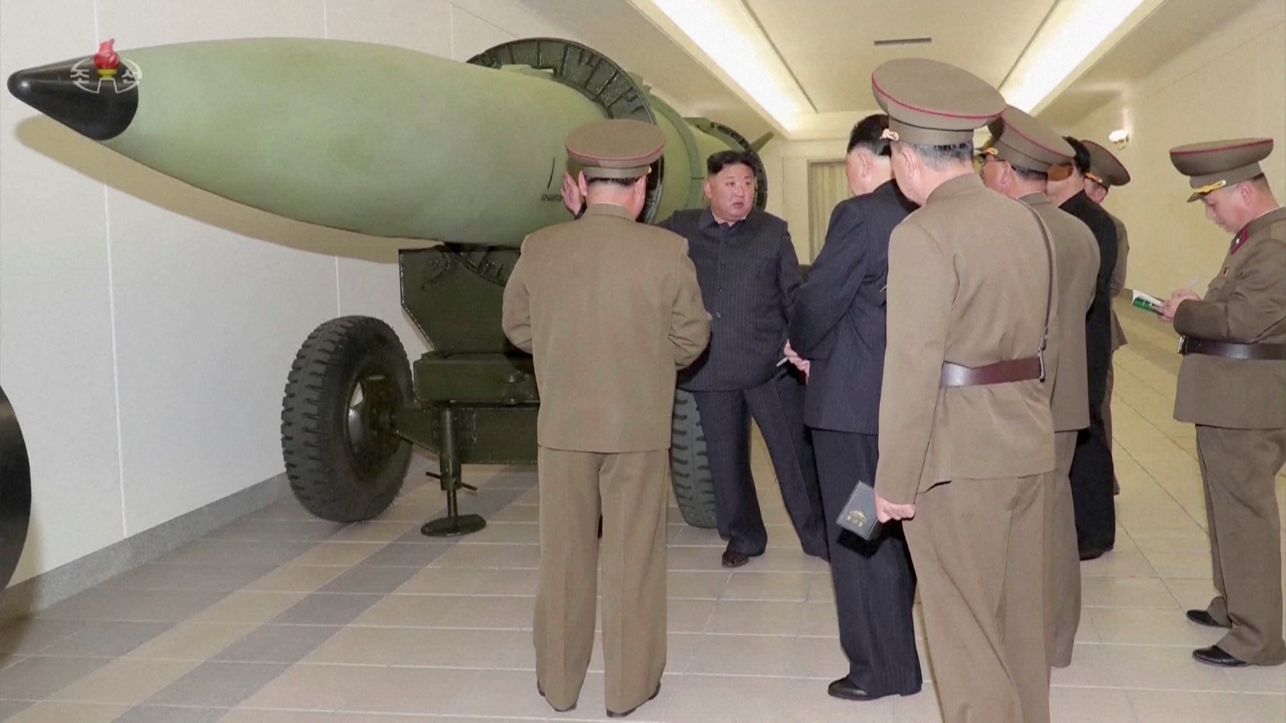 Kim Jong Un inspects nuclear warheads.