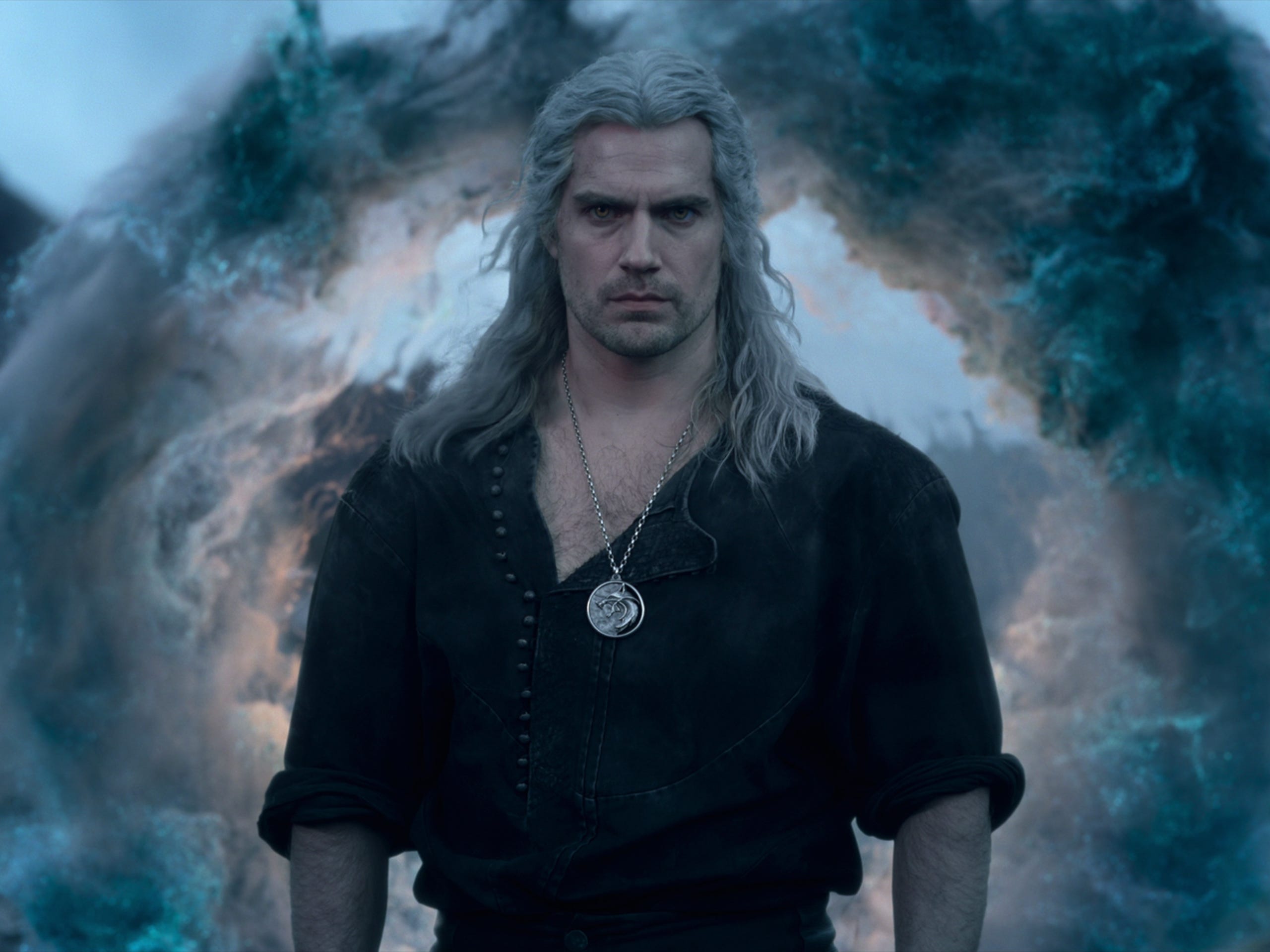 geralt in the witcher, a man with long silver hair and an unbuttoned shirt and silver medallion around his neck. he's standing resolutely in front of a ring of fog