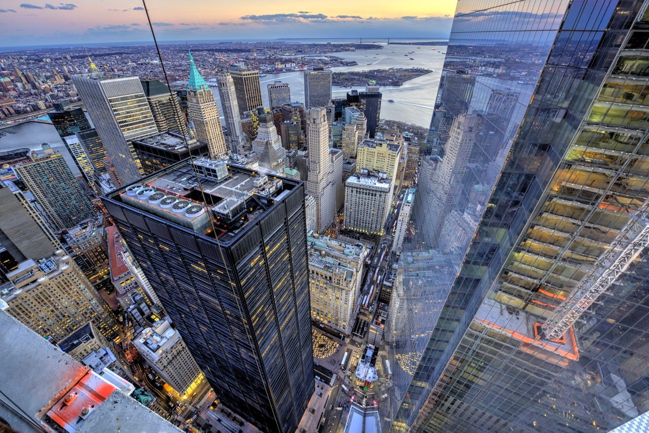 Aerial view of Lower Manhattan skyscrapers with the brown and square One Liberty Plaza in the center