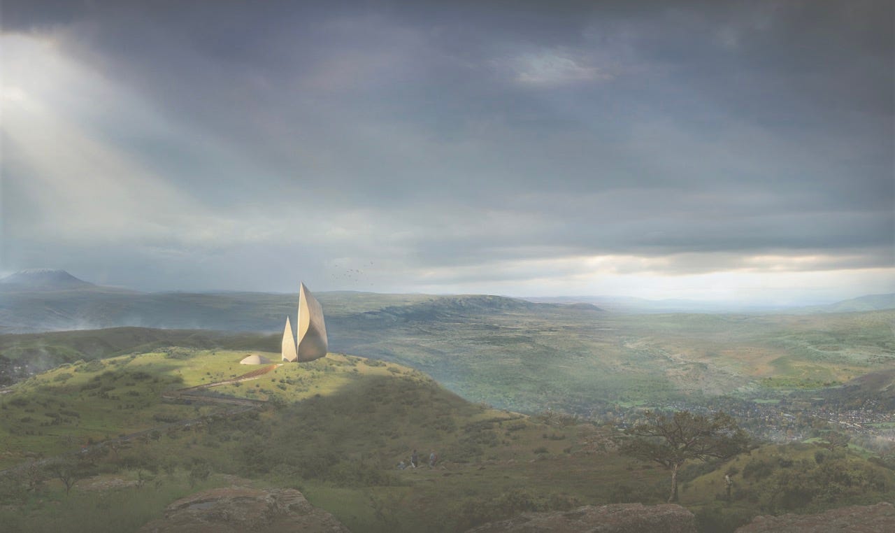 Two spiky, triangular buildings stick out among the grassy hills of the Rift Valley