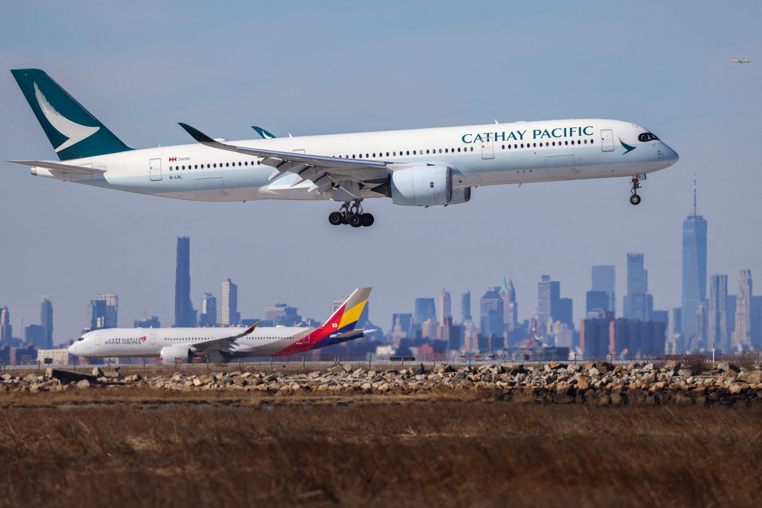 A Cathay Pacific plane landing.