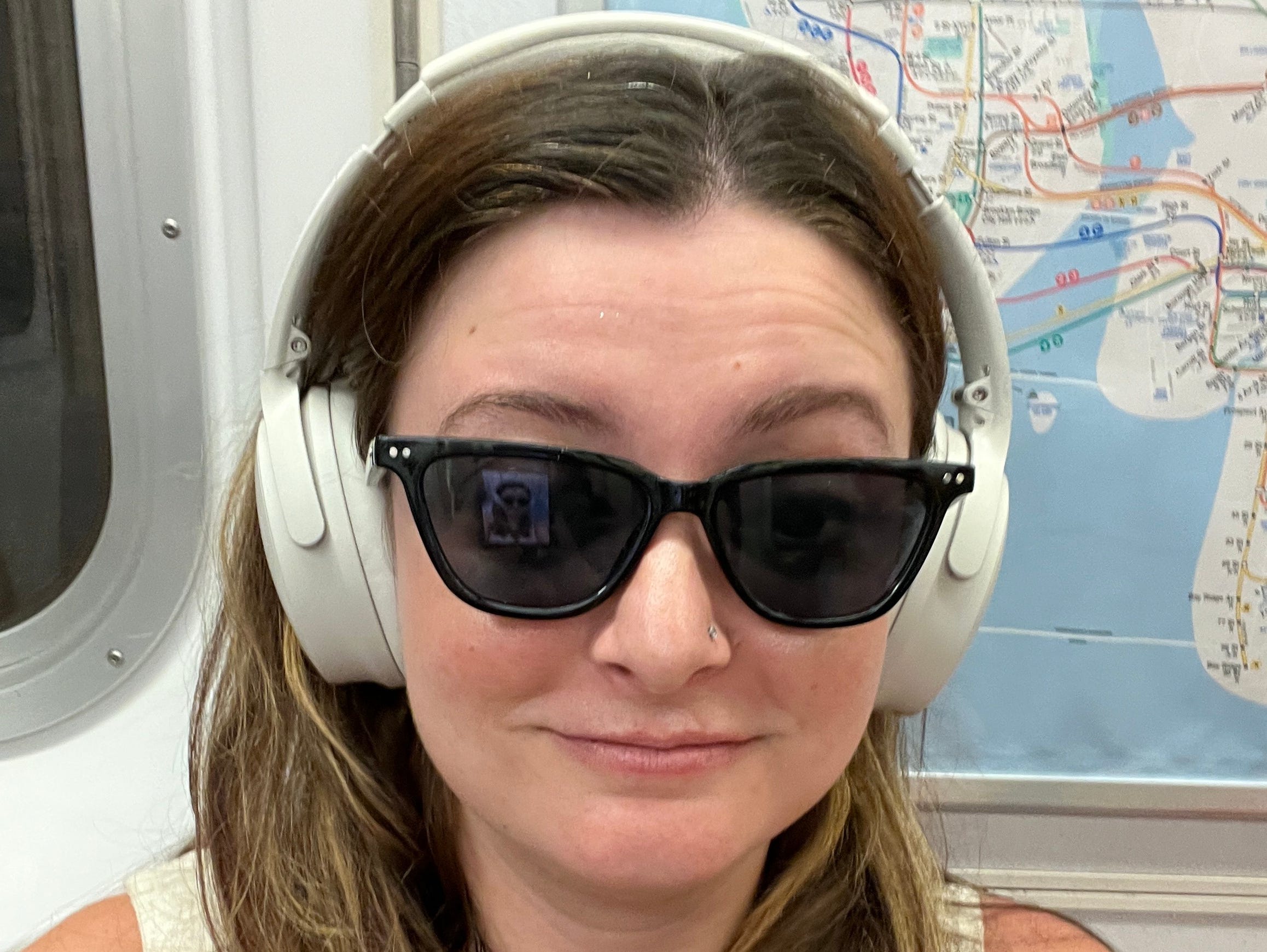 The author wearing her over-ear headphones.