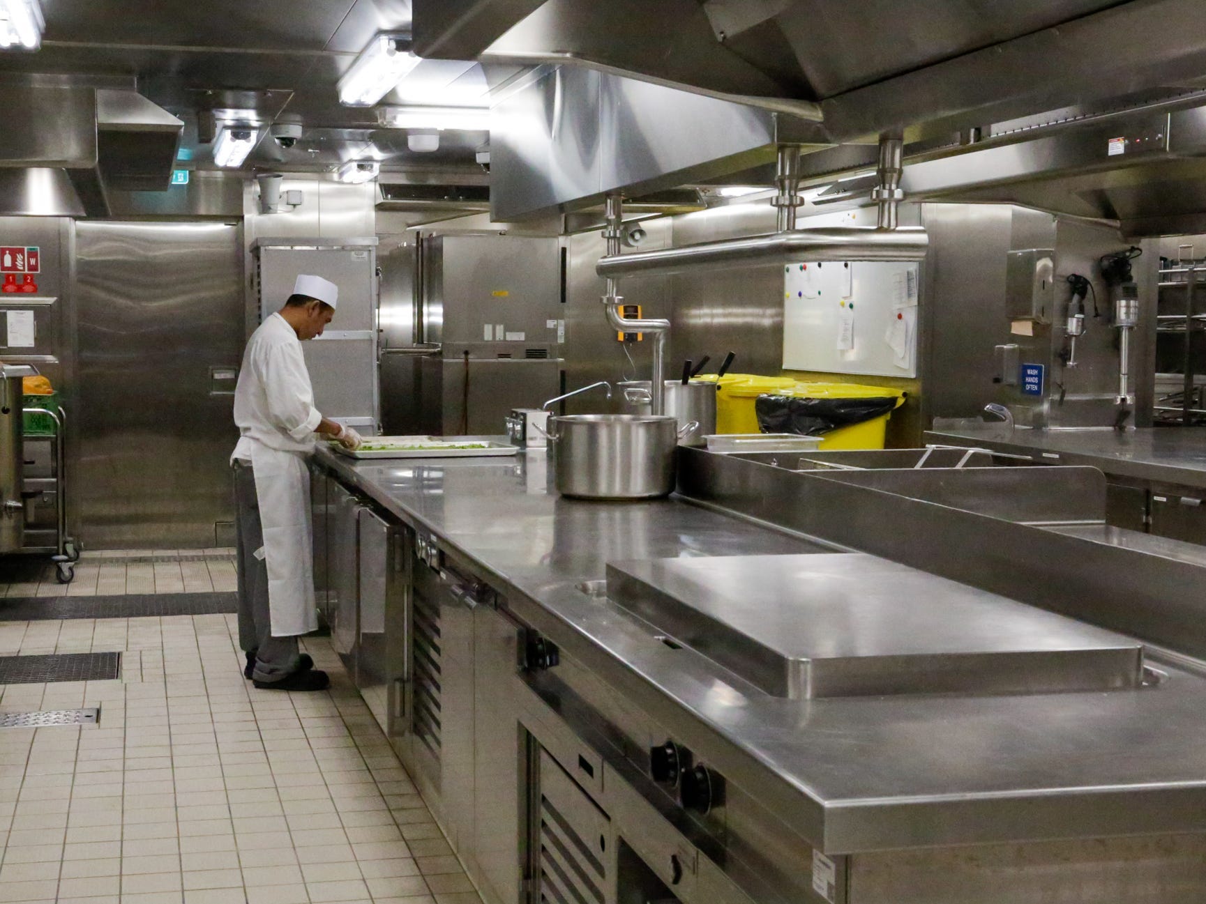 person working in kitchen in Silversea's new Silver Ray