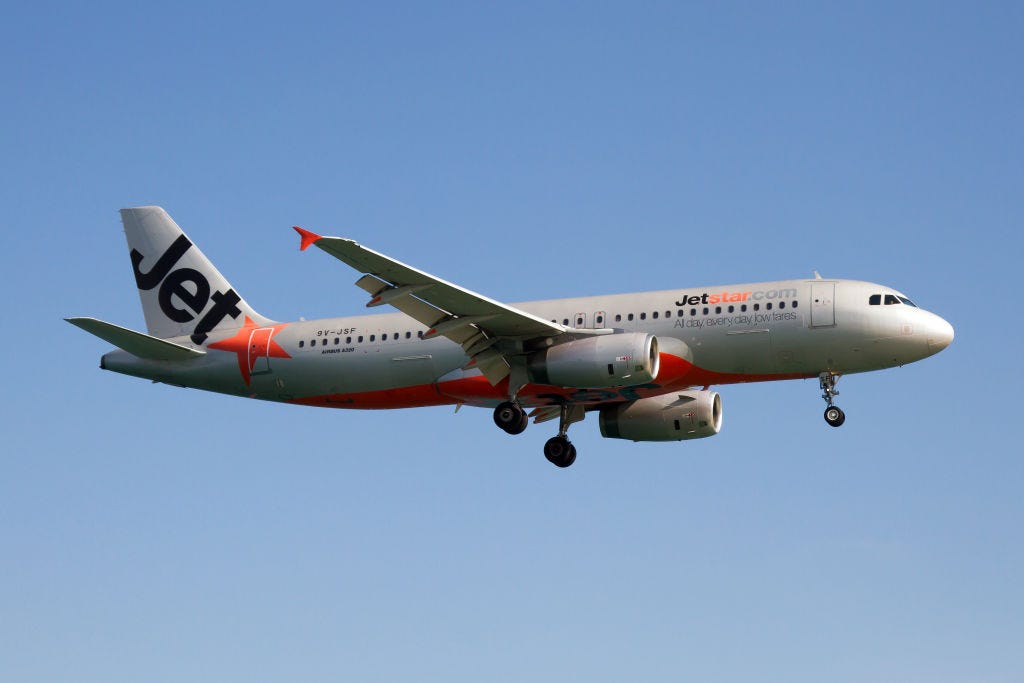 A Jetstar Asia Airways Airbus 320 lands at Phuket airport on March 20, 2018.