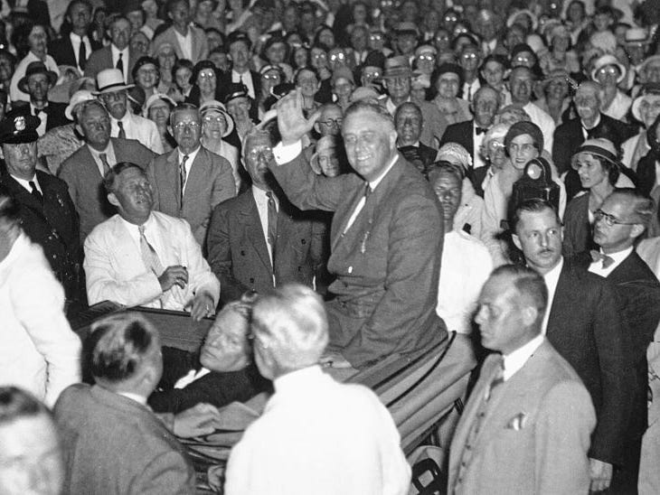 Franklin D. Roosevelt sits in a crowd moments before an assassination attempt.