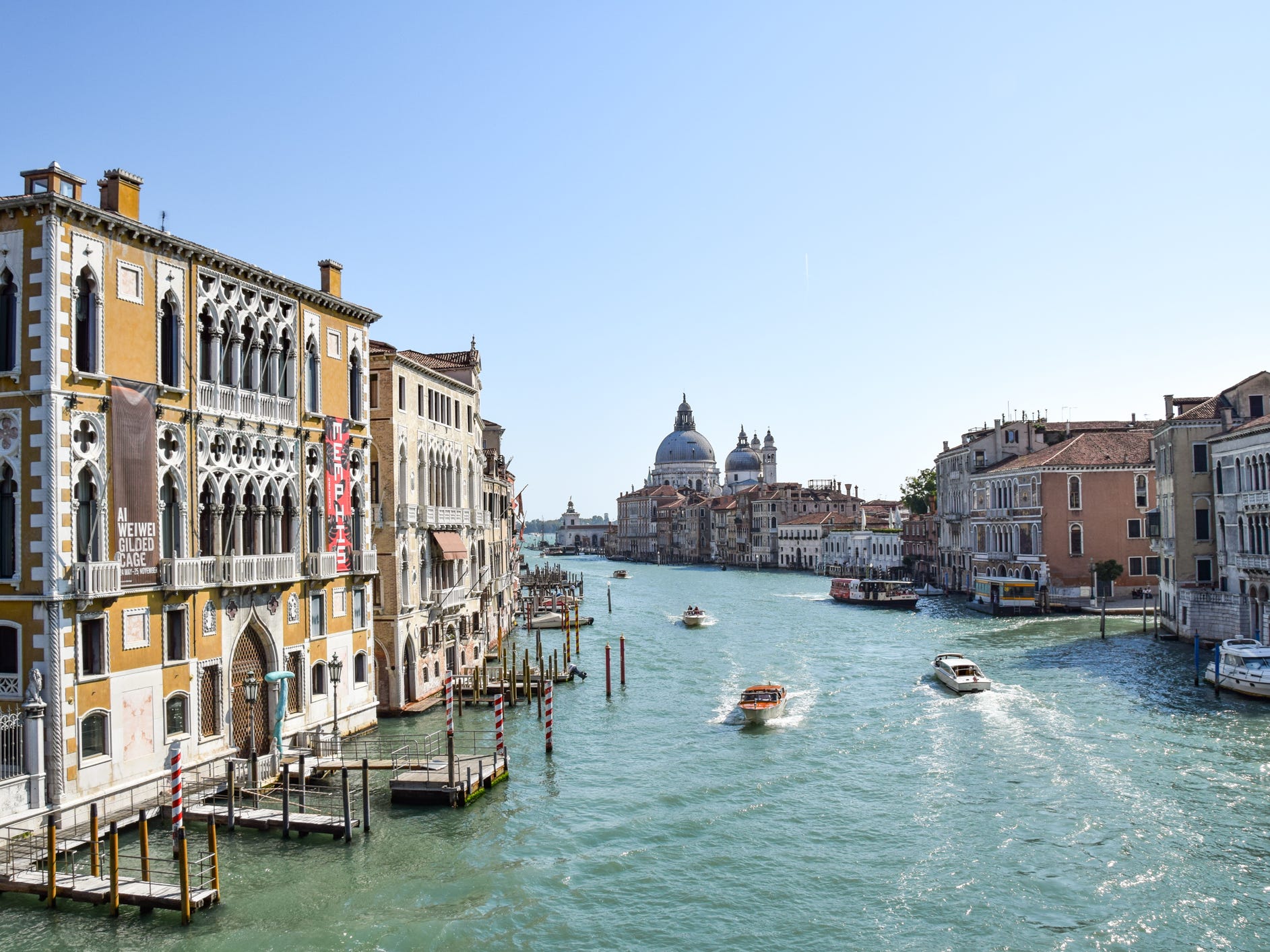 Boats going through Venice's canals in Italy.