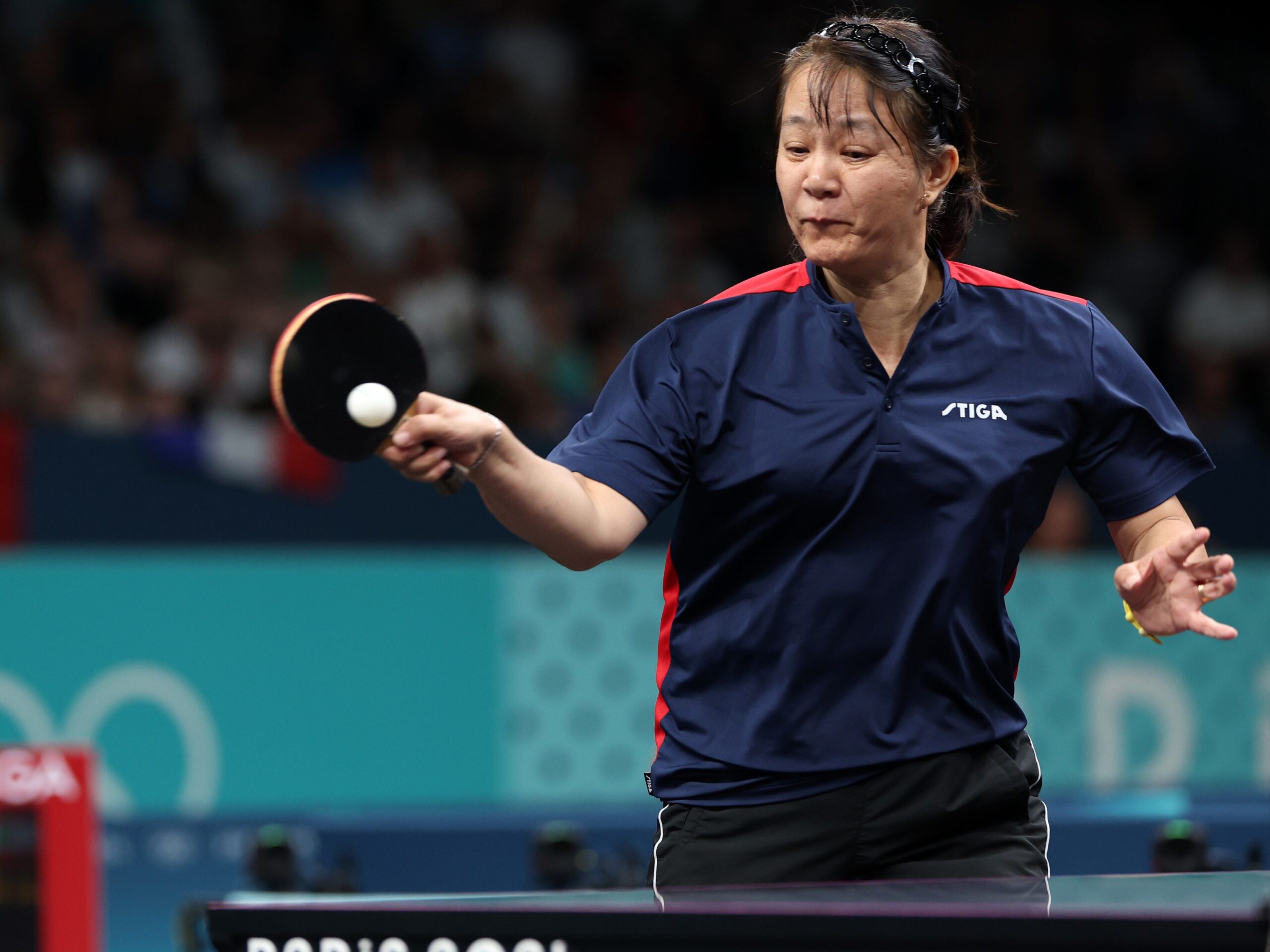 Zhiying Zeng  playing table tennis at the Paris Olympics