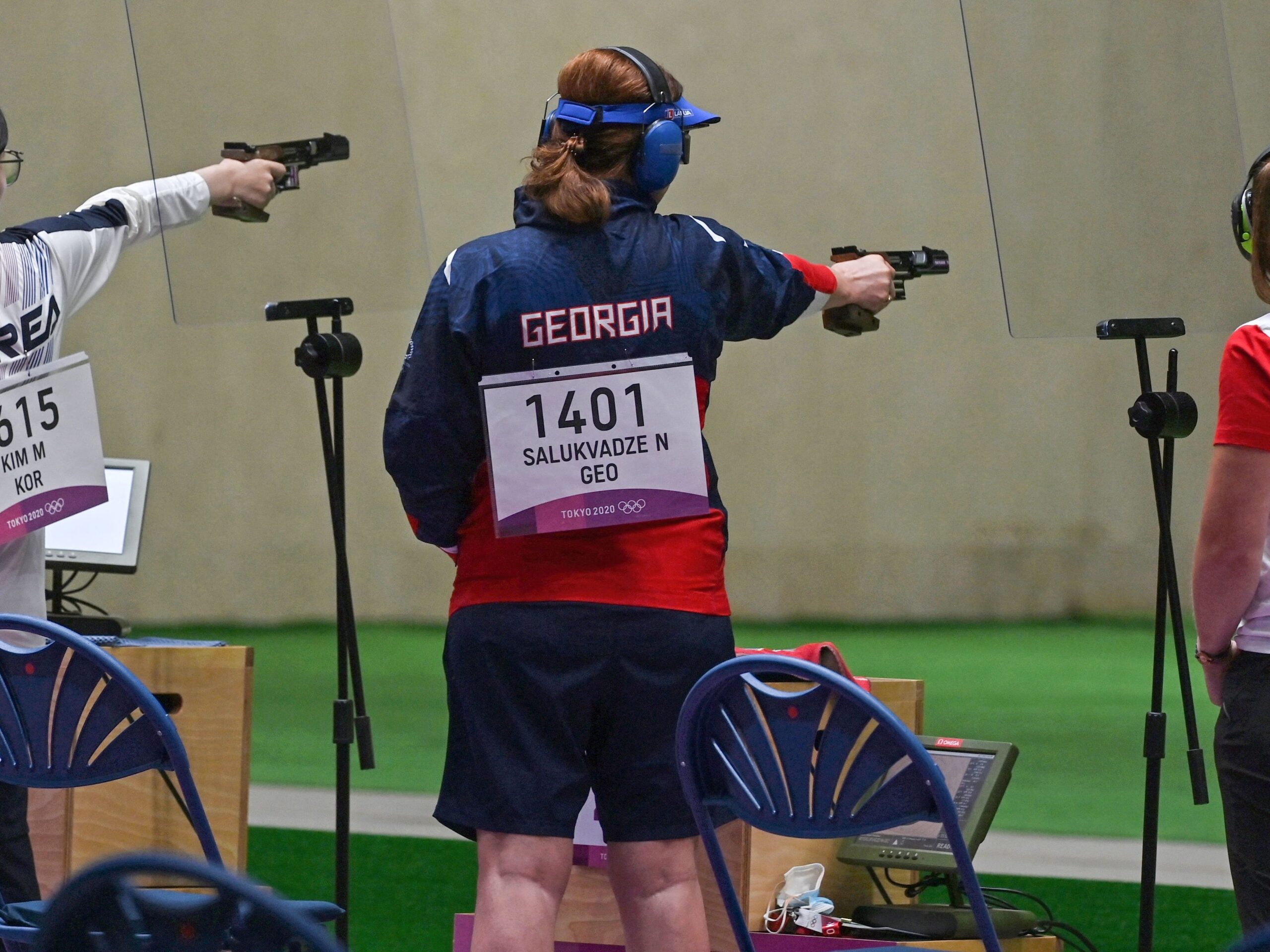 three shooters, including Nino Salukvadze, competing at the tokyo olympics