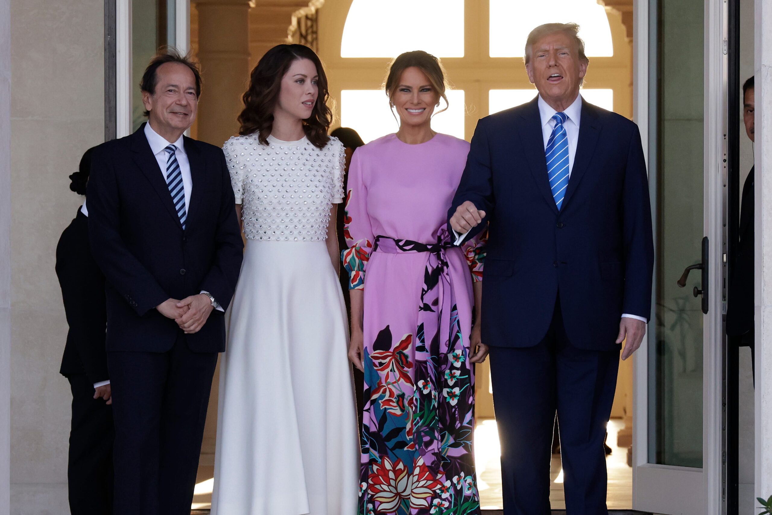 John Paulson, Alina de Almeida, Melania Trump, and Donald Trump attend fundraising event in Palm Beach.