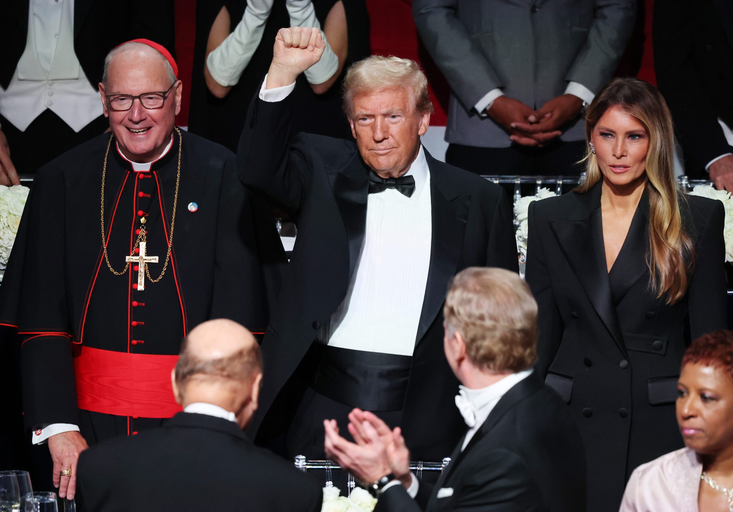 Cardinal Timothy Dolan (Archbishop of New York), Donald Trump, and Melania Trump at the  Alfred E. Smith Foundation Dinner in New York on October 17, 2024.