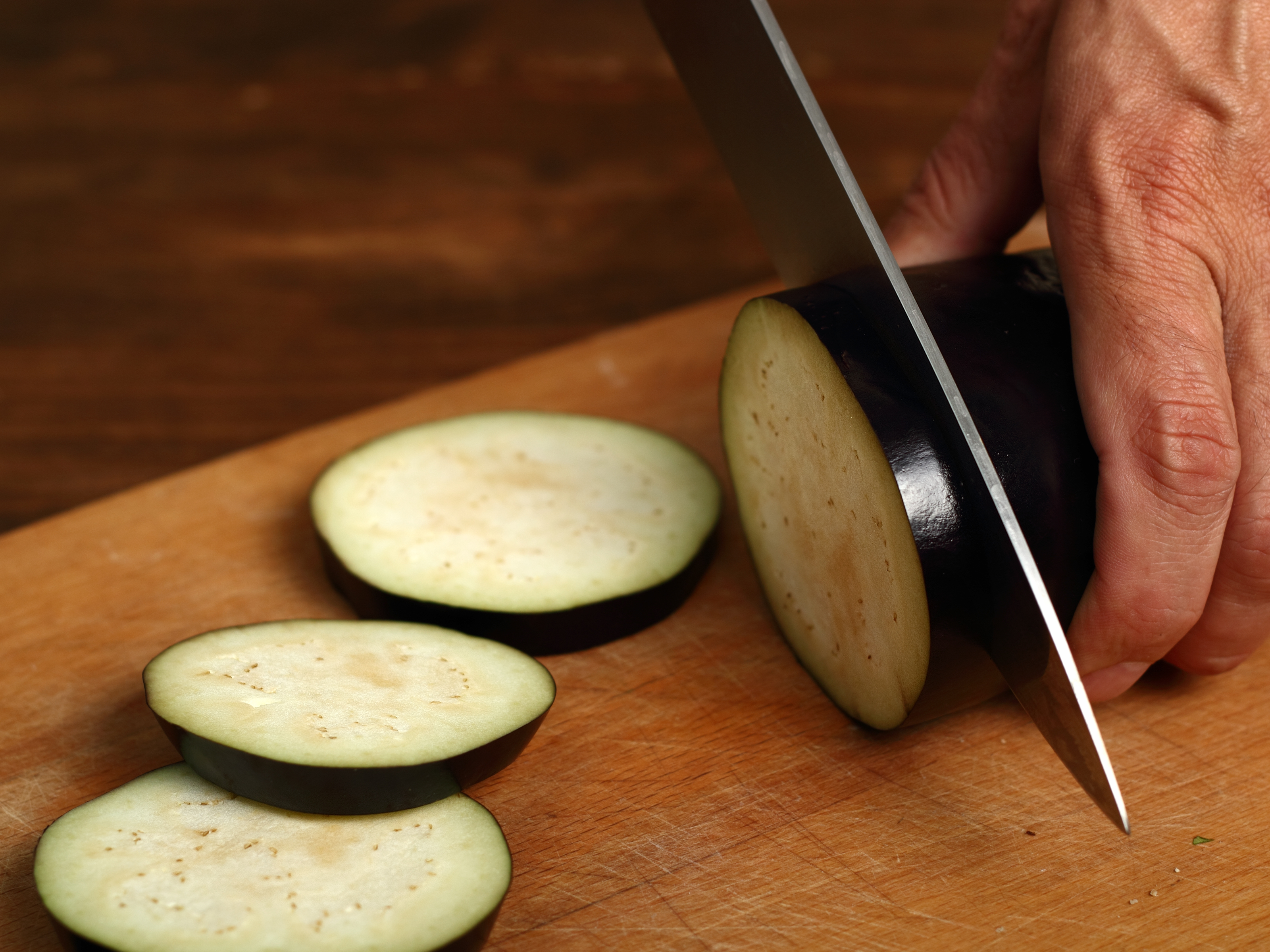 cutting an eggplant