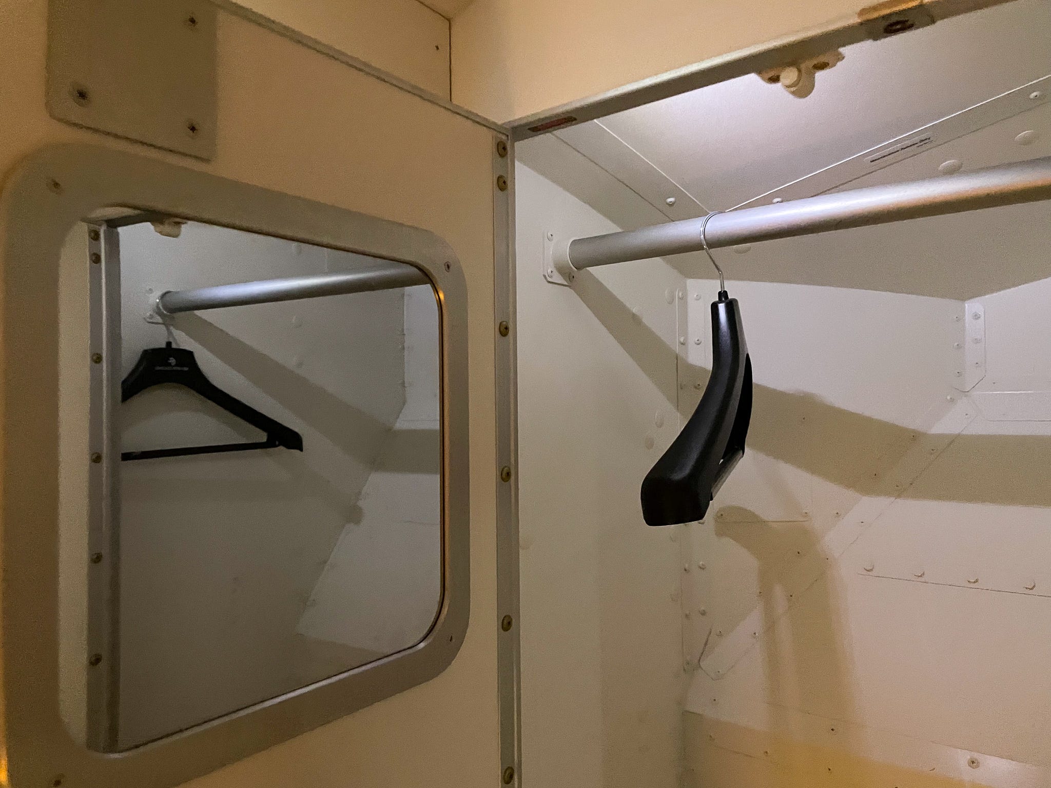 The pilot's rest area has a closet for storing uniforms.