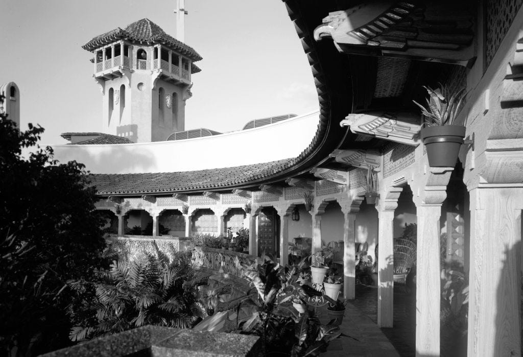 A black-and-white photo of an outdoor terrace at Mar-a-Lago.