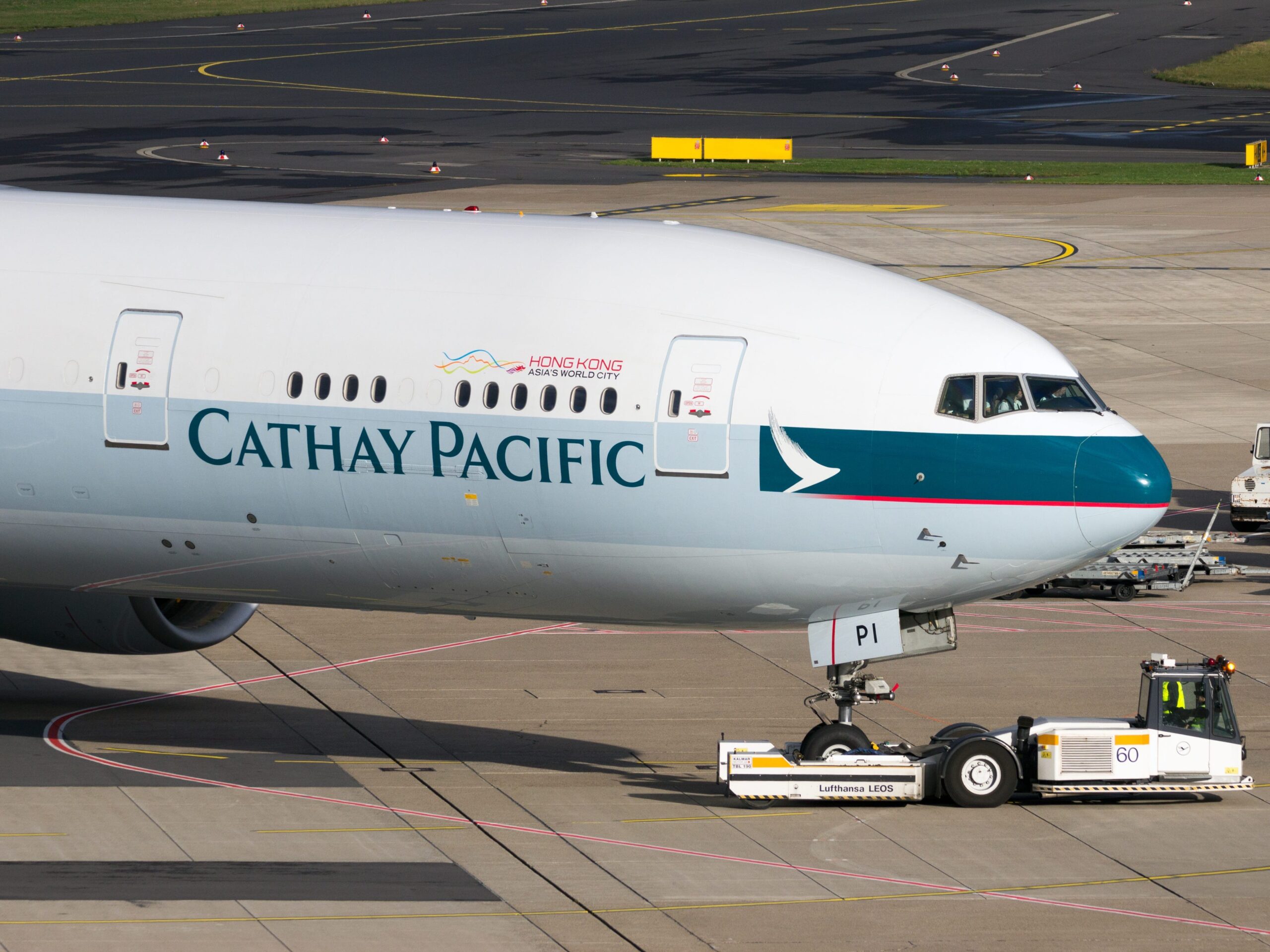 cathay pacific airplane on a tarmac