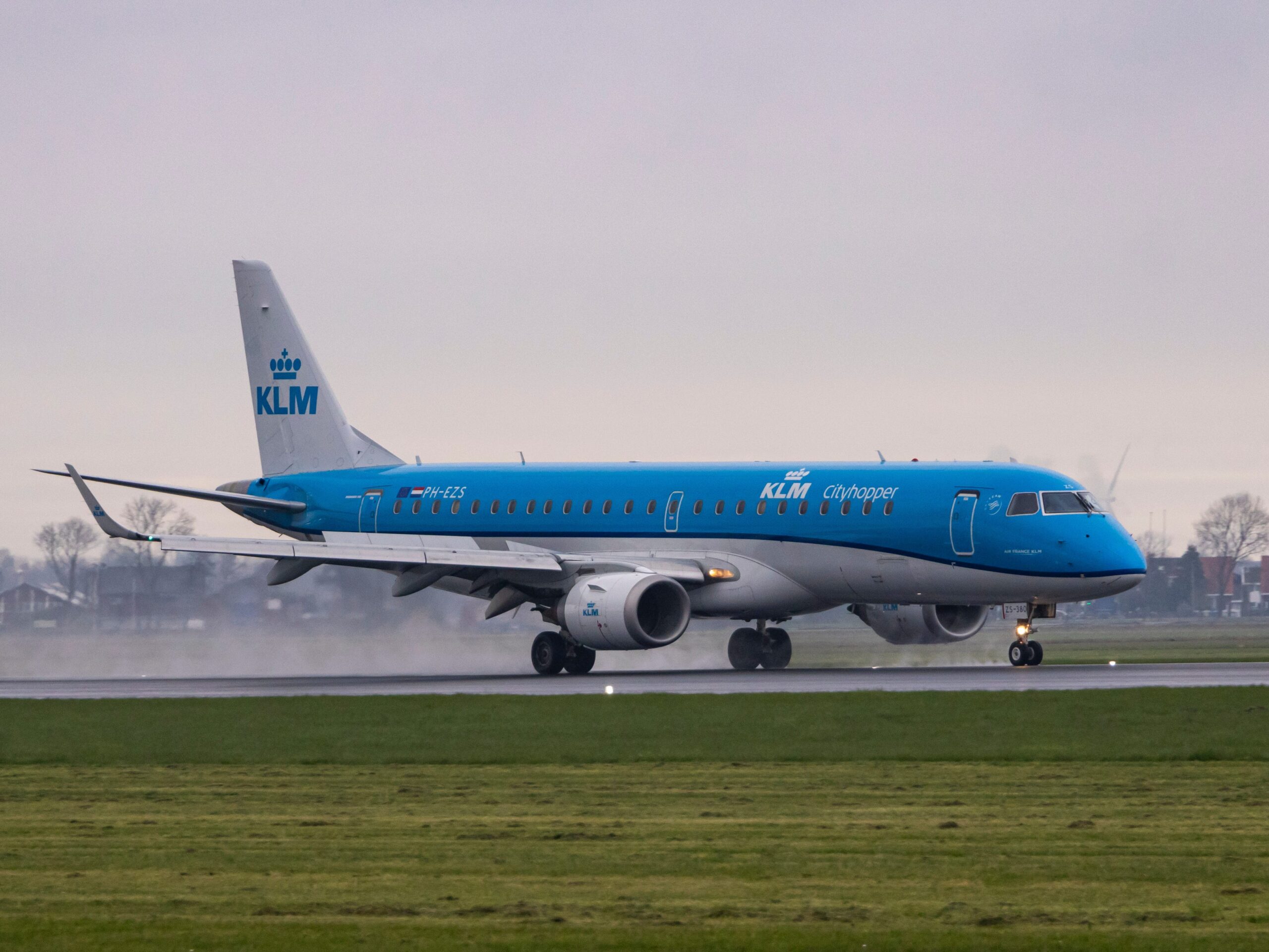 KLM airplane lading on a tarmac at the airport