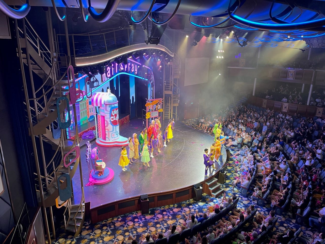 Hairspray performance on stage on Royal Caribbean cruise ship in front of packed audience