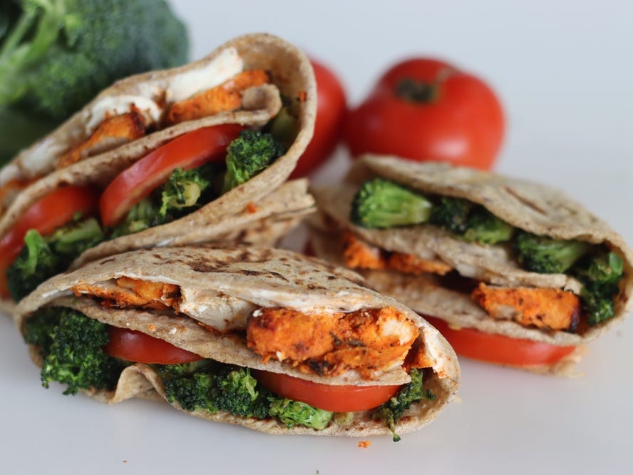 Chicken and vegetables and tomatoes in pita wraps