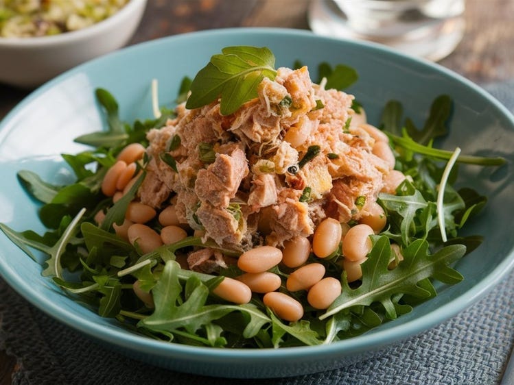 Tuna salad on top of greens with beans