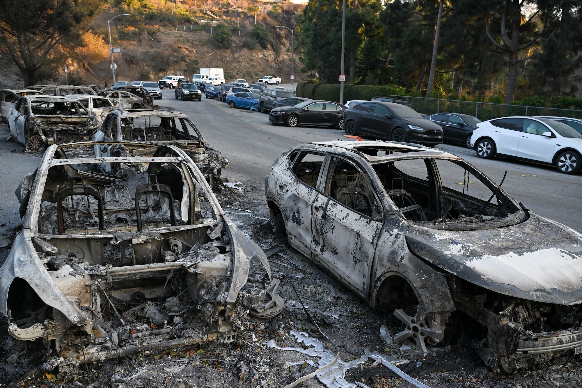 Burned and abandoned vehicles in the Pacific Palisades neighborhood.