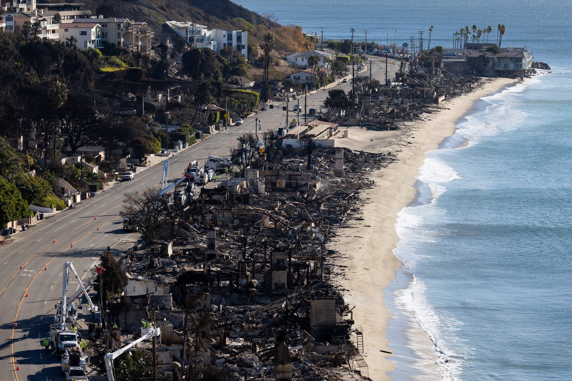 Scorched structures along the Pacific Coast Highway in the aftermath of the Palisades fire.