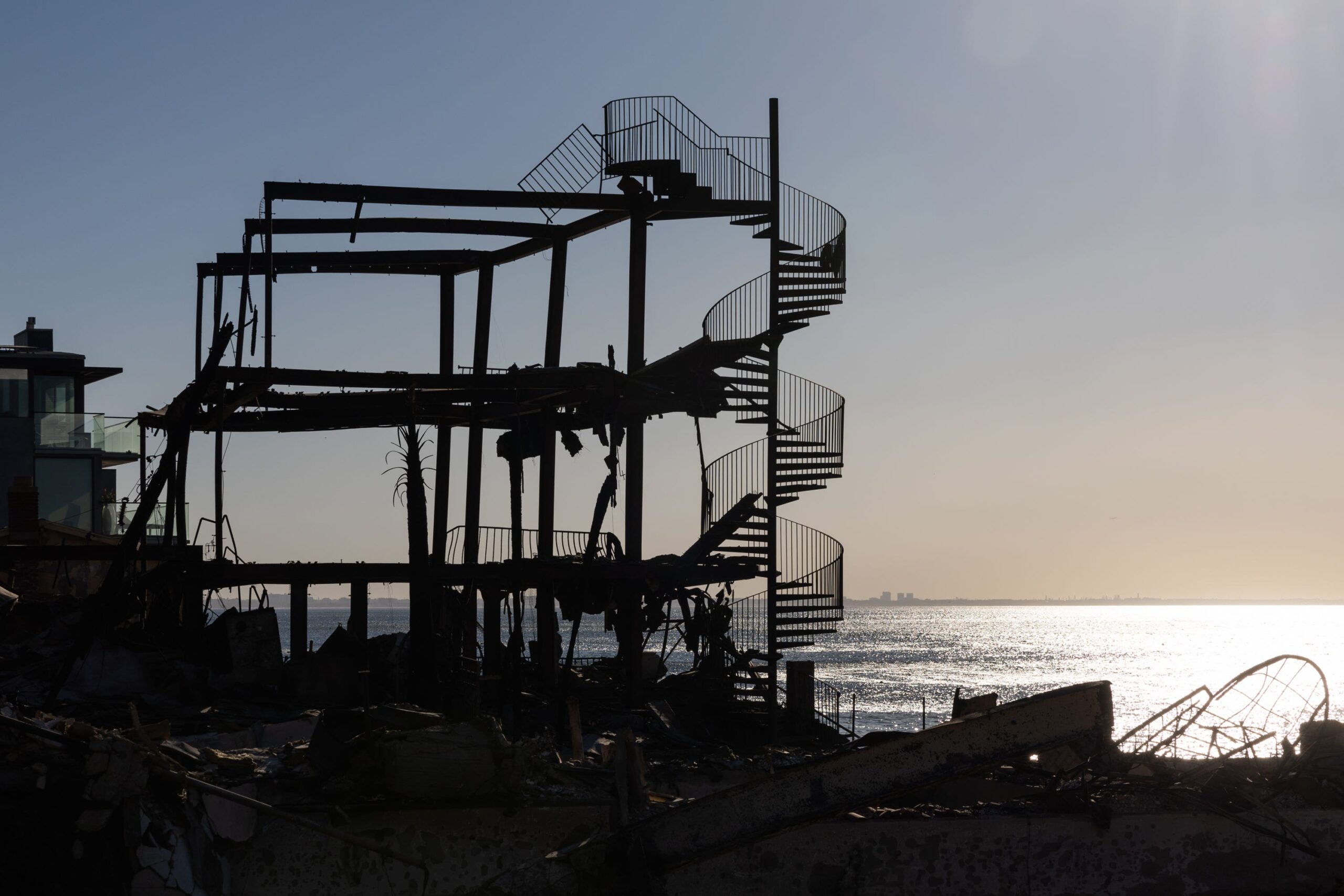 A spiral staircase is seen among scorched structures on the Palisades section of Pacific Coast Highway after wildfires on January 12, 2025 in Los Angeles, California.