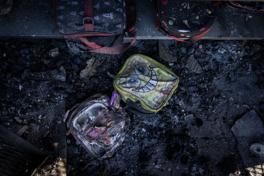 Backpacks lie amid the rubble of the Marquez Charter Elementary School.