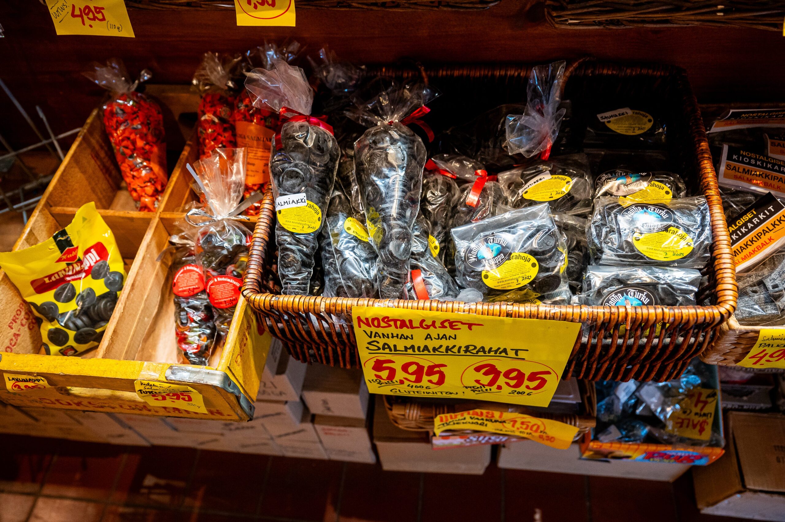 A basket of bags of salmiakki, Finnish black licorice, for sale