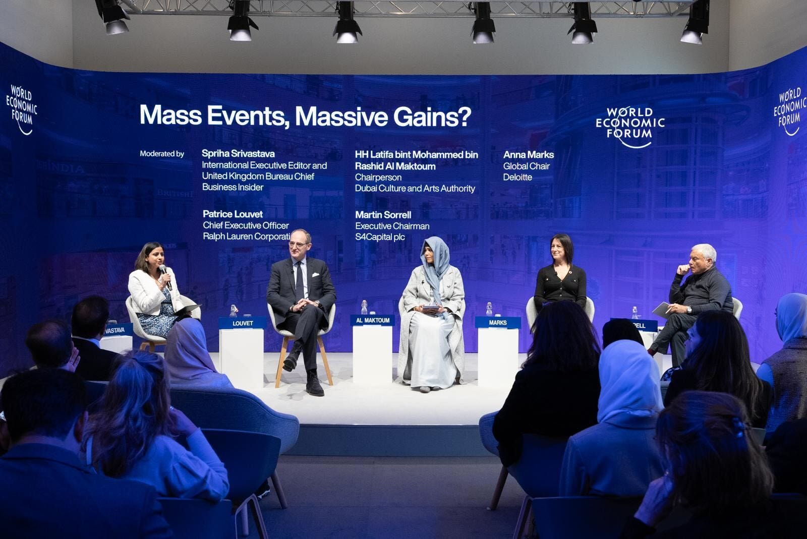 BI's Spriha Srivastava moderating a panel at Davos.