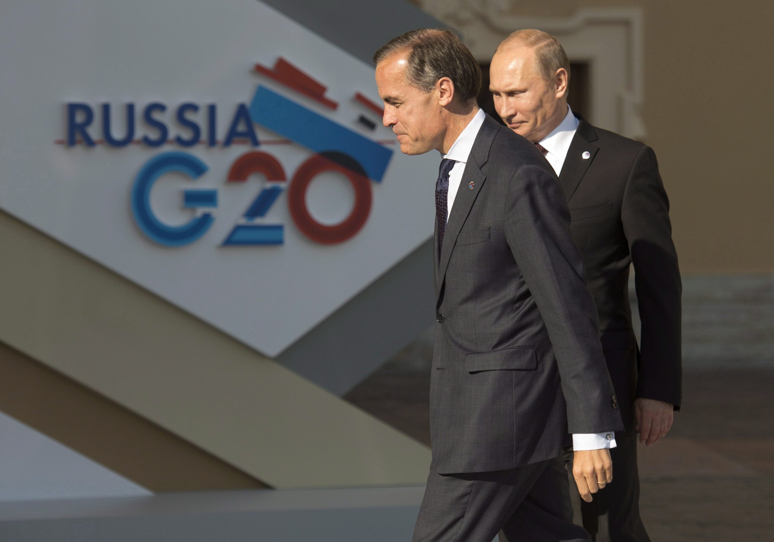 Toenmalig gouverneur van de Bank of England Mark Carney met de Russische president Vladimir Poetin bij een G20-bijeenkomst in 2013 in Sint-Petersburg. Foto: The Canadian Press / Adrian Wyld