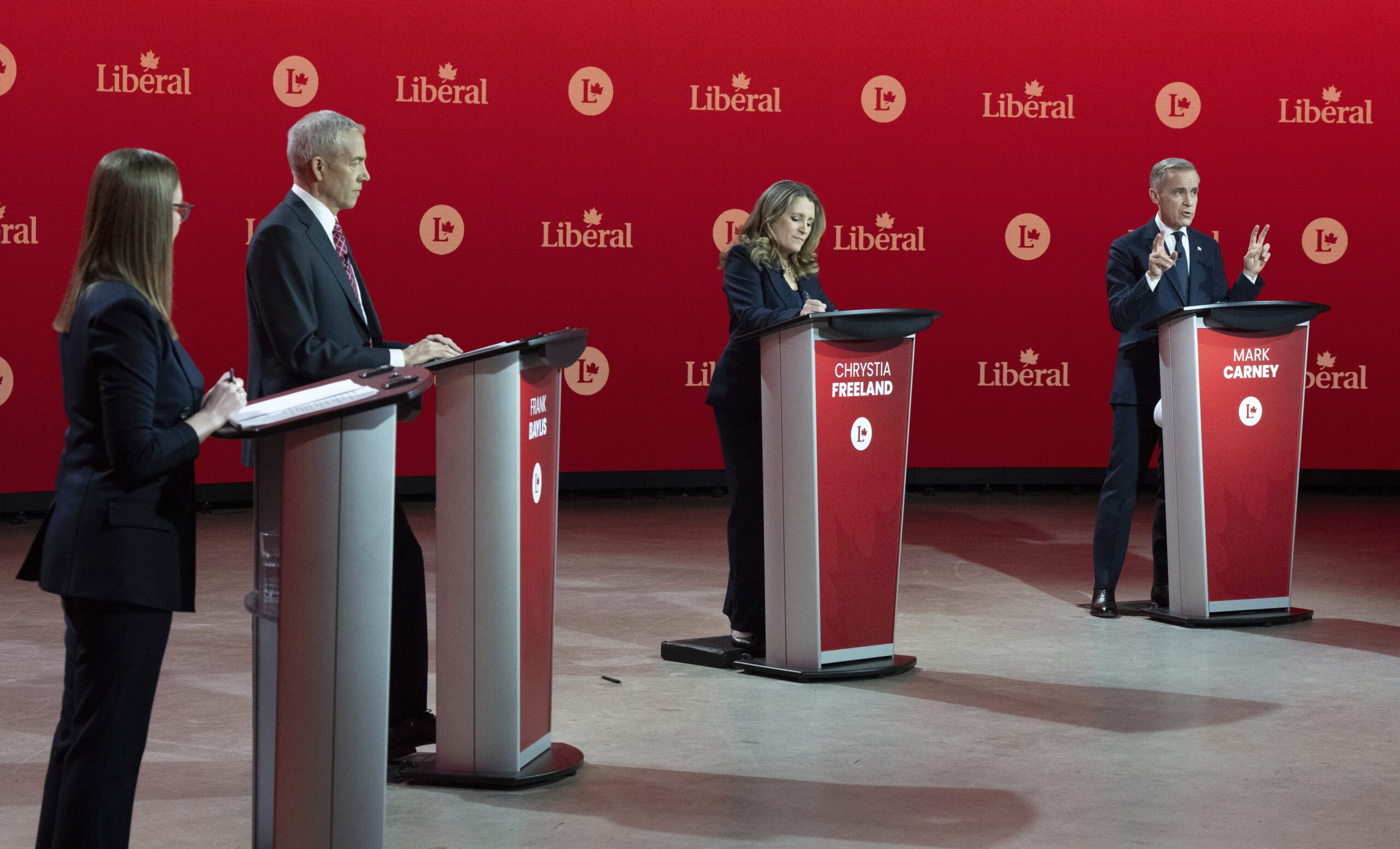 Mark Carney in debat met de andere kandidaten oor het leiderschap van de Liberale Partij van Canada. Foto: Christinne Muschi / The Canadian Press via AP, ANP 